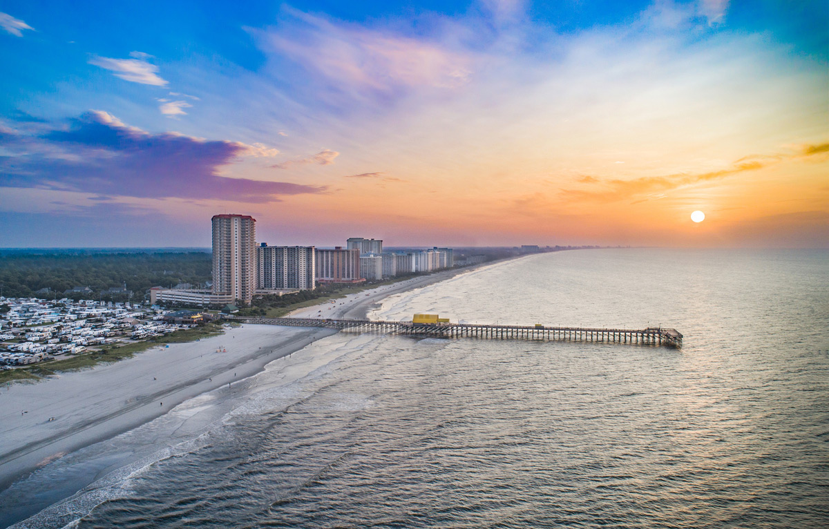 Myrtle Beach shoreline and pier at sunrise